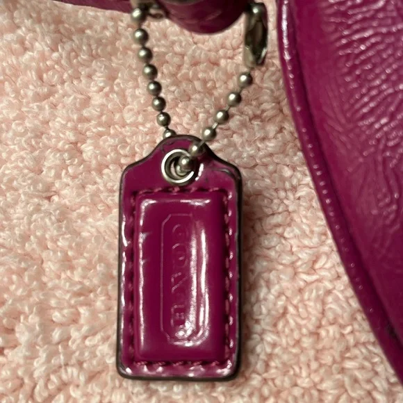 Coach
Poppy Plum/Purple Patent Leather Wristlet - Picture 2 of 7